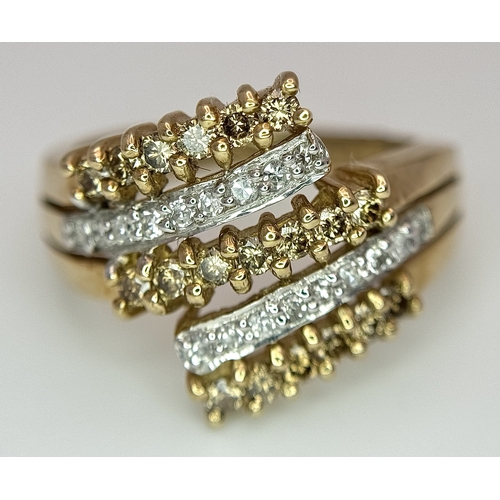1755 - A 9K Yellow Gold Diamond Crossover Ring. 4.4g total weight. 0.36ctw diamonds. Ring size O. Ref: 7722... 