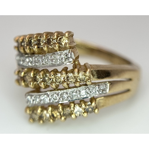 1755 - A 9K Yellow Gold Diamond Crossover Ring. 4.4g total weight. 0.36ctw diamonds. Ring size O. Ref: 7722... 