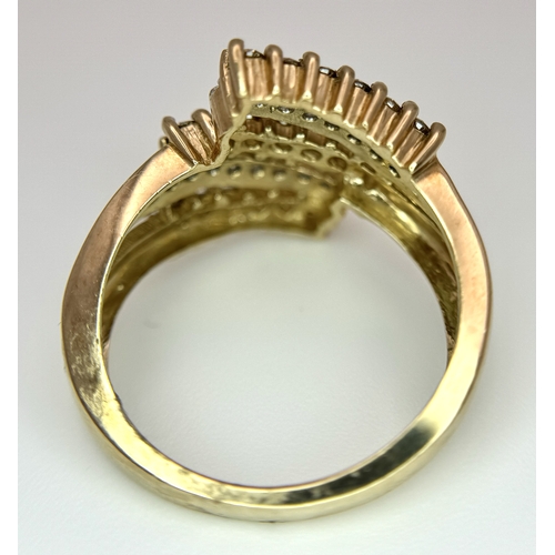 1755 - A 9K Yellow Gold Diamond Crossover Ring. 4.4g total weight. 0.36ctw diamonds. Ring size O. Ref: 7722... 