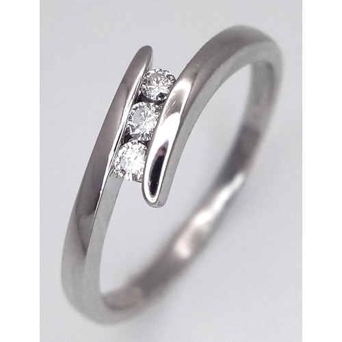 1717 - A Platinum Diamond Trilogy Ring. 2.9g total weight. 0.06ctw diamonds. Ring size M. Ref: 6783H