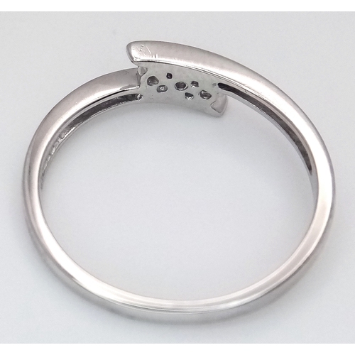 1717 - A Platinum Diamond Trilogy Ring. 2.9g total weight. 0.06ctw diamonds. Ring size M. Ref: 6783H