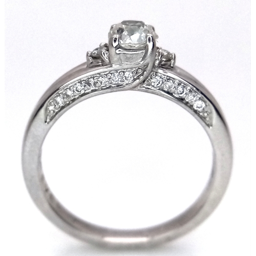 1765 - An 18k white gold diamond trilogy ring with diamond underside, 0.40ct diamond weight, 4.2g total wei... 