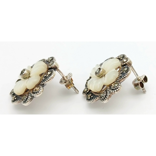 567 - Genuine Pair of ‘HOBBS’  SILVER MARCASITE EARRINGS. Having mother-of-pearl floral detail. complete w... 