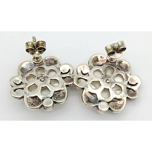 567 - Genuine Pair of ‘HOBBS’  SILVER MARCASITE EARRINGS. Having mother-of-pearl floral detail. complete w... 