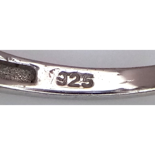 648 - A Stylish Sterling Silver Smoky Quartz and White Spinel Ring Size N. The Ring is set with 8mm Long M... 