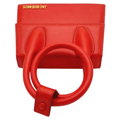 935 - A Jacquemus Le Chiquito Red Leather Mini Handbag. Gold-tone hardware. Single flap closure. Twist han... 