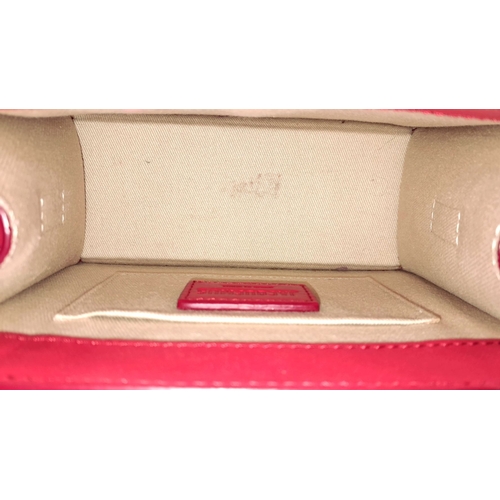 935 - A Jacquemus Le Chiquito Red Leather Mini Handbag. Gold-tone hardware. Single flap closure. Twist han... 