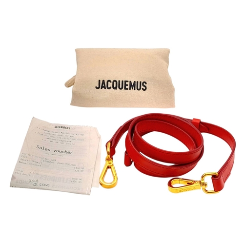 935 - A Jacquemus Le Chiquito Red Leather Mini Handbag. Gold-tone hardware. Single flap closure. Twist han... 
