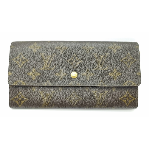 977 - A Louis Vuitton Rectangular Monogram Canvas Wallet. 19cm width x 10cm height. STK025471