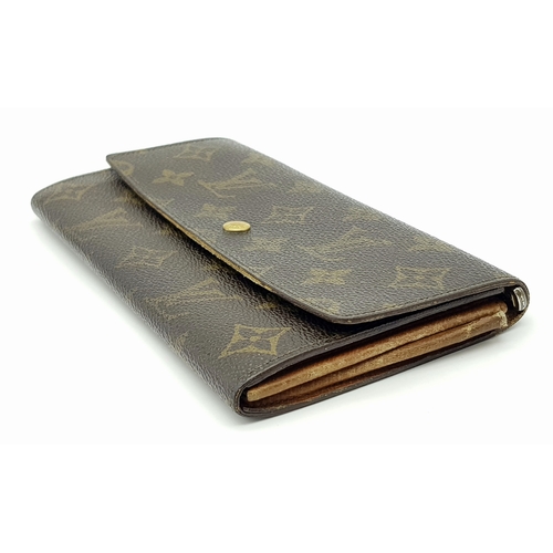 977 - A Louis Vuitton Rectangular Monogram Canvas Wallet. 19cm width x 10cm height. STK025471