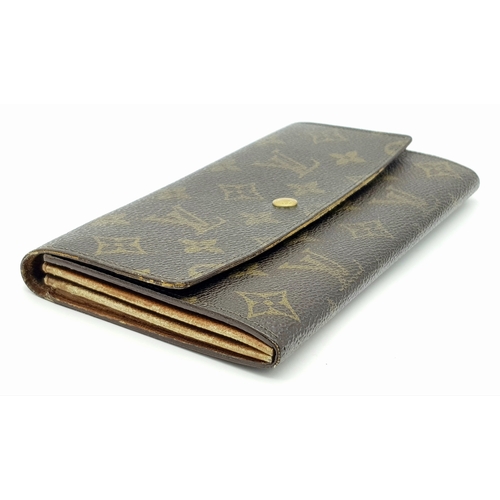 977 - A Louis Vuitton Rectangular Monogram Canvas Wallet. 19cm width x 10cm height. STK025471