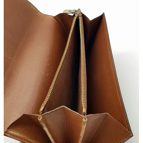 977 - A Louis Vuitton Rectangular Monogram Canvas Wallet. 19cm width x 10cm height. STK025471