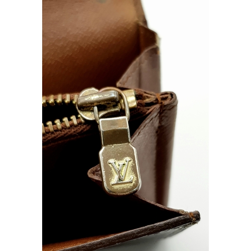 977 - A Louis Vuitton Rectangular Monogram Canvas Wallet. 19cm width x 10cm height. STK025471