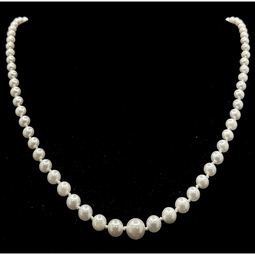 1213 - A Vintage Cultured Pearl Necklace. Sterling silver clasp. 54cm length. STK025060