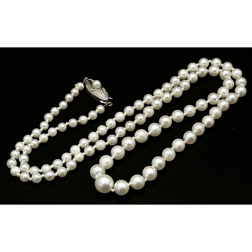 1213 - A Vintage Cultured Pearl Necklace. Sterling silver clasp. 54cm length. STK025060