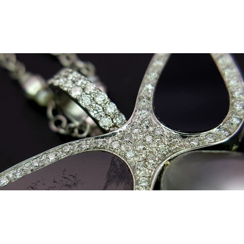 1269 - An Angelic 18K Gold, Tahitian Pearl and Black Onyx Pendant on an 18K White Gold Fancy Chain. Pendant... 