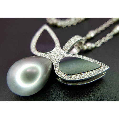 1269 - An Angelic 18K Gold, Tahitian Pearl and Black Onyx Pendant on an 18K White Gold Fancy Chain. Pendant... 