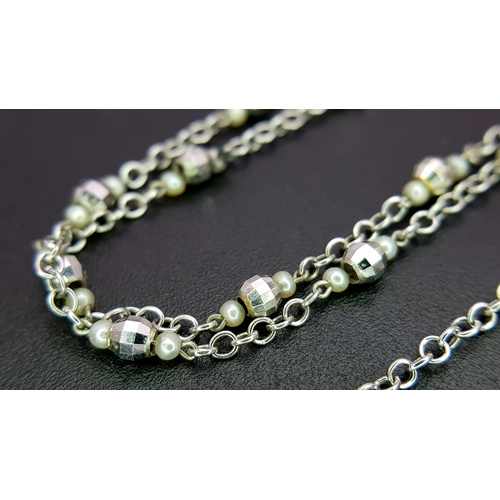 1269 - An Angelic 18K Gold, Tahitian Pearl and Black Onyx Pendant on an 18K White Gold Fancy Chain. Pendant... 