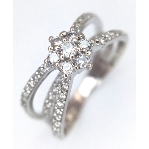 1360 - An 18K White Gold Diamond Crossover Pave Set and Cluster Ring. Size M. 4.3g. Ref: 8.11