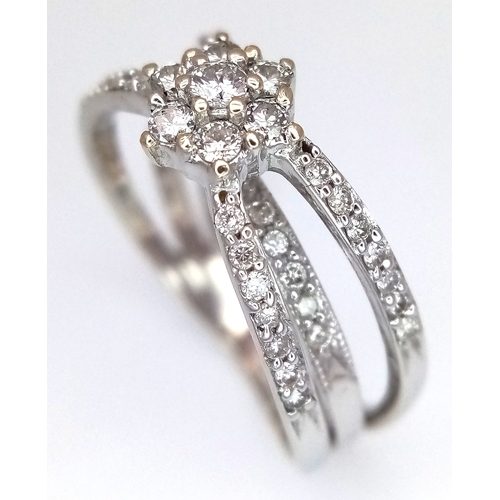 1360 - An 18K White Gold Diamond Crossover Pave Set and Cluster Ring. Size M. 4.3g. Ref: 8.11