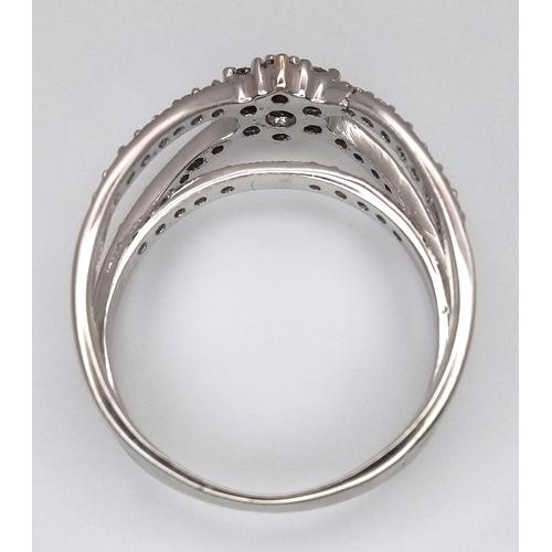 1360 - An 18K White Gold Diamond Crossover Pave Set and Cluster Ring. Size M. 4.3g. Ref: 8.11