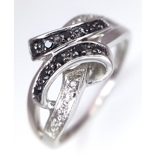 1862 - A 9K Yellow Gold Sapphire and Diamond Crossover Ring. Size J 1/2. 2.4g. Ref: 8.3