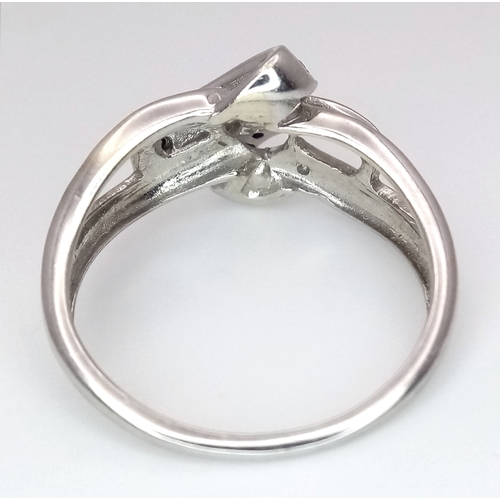 1862 - A 9K Yellow Gold Sapphire and Diamond Crossover Ring. Size J 1/2. 2.4g. Ref: 8.3