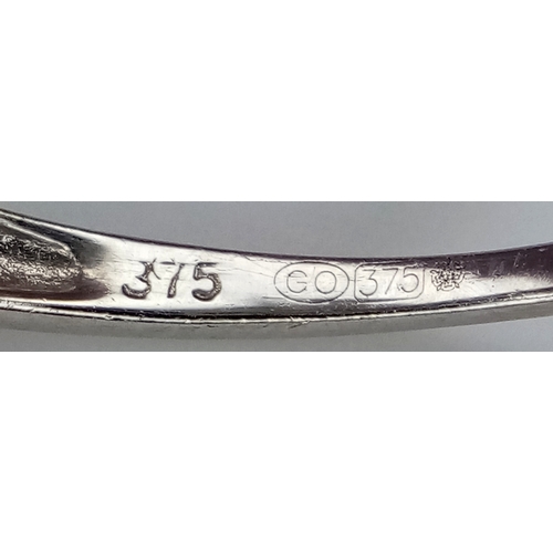 1862 - A 9K Yellow Gold Sapphire and Diamond Crossover Ring. Size J 1/2. 2.4g. Ref: 8.3