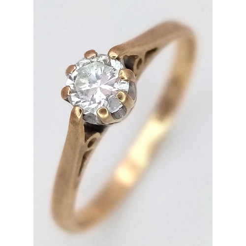580 - A 9K Yellow Gold White Stone Solitaire Ring. Size K. 1.1g.