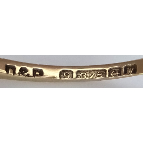 906 - A 9K Yellow Gold Red Stone Ring. Size L. 1.8g.