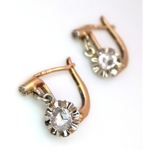 1170 - A Pair of Antique Dormeuse 18K Gold (tests as) Diamond Lever-back Earrings. 0.3ctw old cut diamonds.... 