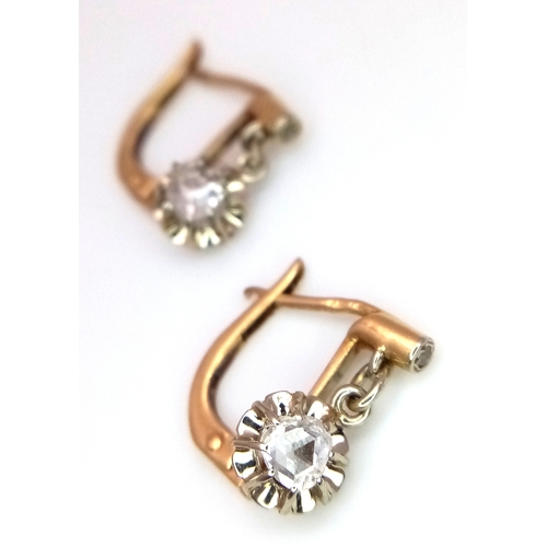 1170 - A Pair of Antique Dormeuse 18K Gold (tests as) Diamond Lever-back Earrings. 0.3ctw old cut diamonds.... 