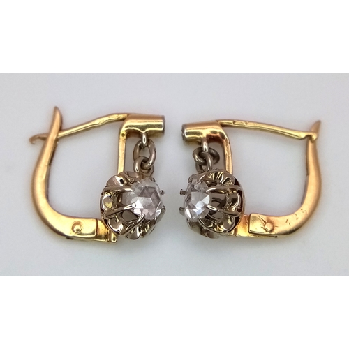 1170 - A Pair of Antique Dormeuse 18K Gold (tests as) Diamond Lever-back Earrings. 0.3ctw old cut diamonds.... 