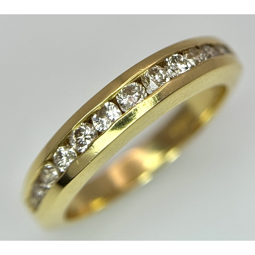 1432 - An 18K Yellow Gold, Diamond Channel Set Ring. 14 diamonds - 0.50ctw. Size N. 5.4g.