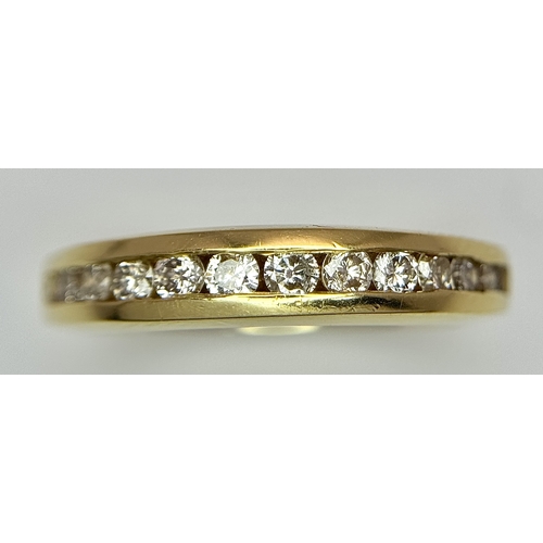 1432 - An 18K Yellow Gold, Diamond Channel Set Ring. 14 diamonds - 0.50ctw. Size N. 5.4g.