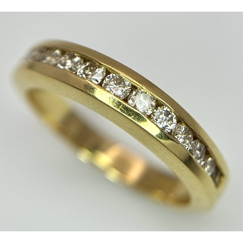1432 - An 18K Yellow Gold, Diamond Channel Set Ring. 14 diamonds - 0.50ctw. Size N. 5.4g.