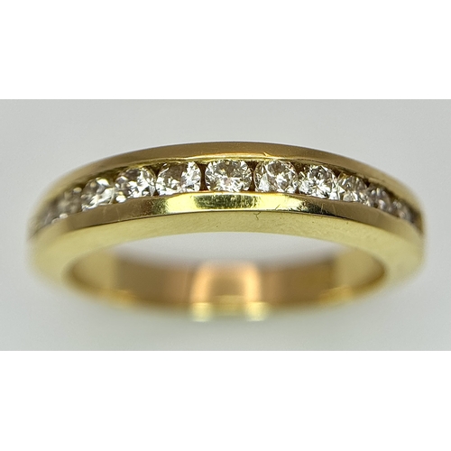 1432 - An 18K Yellow Gold, Diamond Channel Set Ring. 14 diamonds - 0.50ctw. Size N. 5.4g.