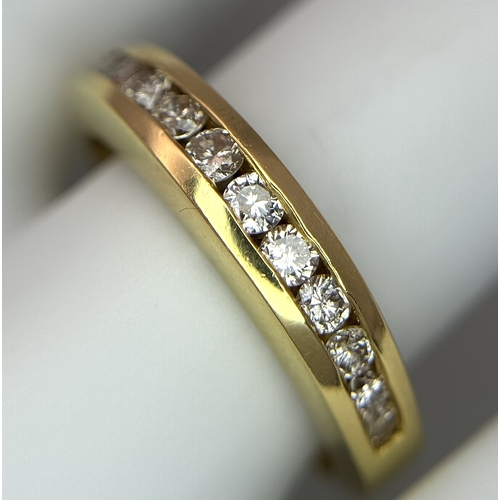 1432 - An 18K Yellow Gold, Diamond Channel Set Ring. 14 diamonds - 0.50ctw. Size N. 5.4g.