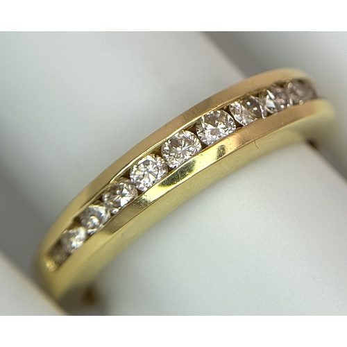 1432 - An 18K Yellow Gold, Diamond Channel Set Ring. 14 diamonds - 0.50ctw. Size N. 5.4g.