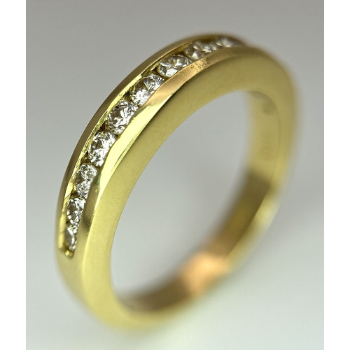 1432 - An 18K Yellow Gold, Diamond Channel Set Ring. 14 diamonds - 0.50ctw. Size N. 5.4g.