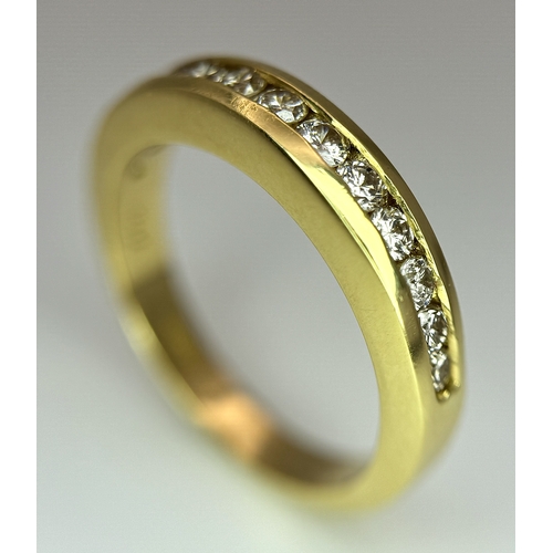 1432 - An 18K Yellow Gold, Diamond Channel Set Ring. 14 diamonds - 0.50ctw. Size N. 5.4g.