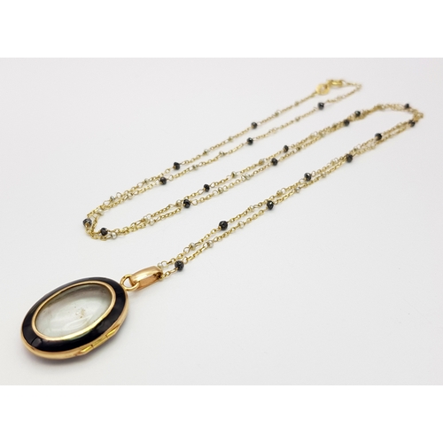 1791 - An 18K Gold, Black Onyx Oval Locket on an 18K Black diamond and Pearl Necklace. 3cm and 66cm. 5.4g t... 