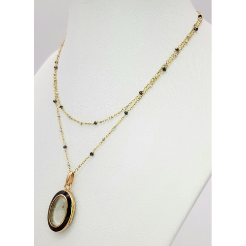 1791 - An 18K Gold, Black Onyx Oval Locket on an 18K Black diamond and Pearl Necklace. 3cm and 66cm. 5.4g t... 