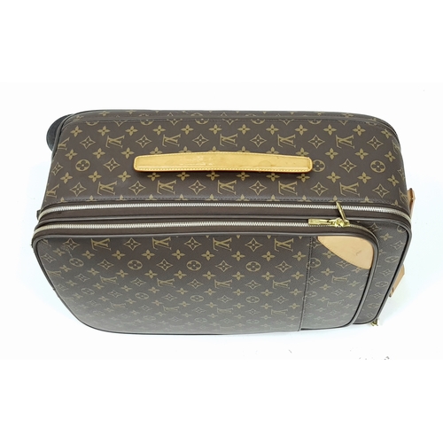 790 - A Louis Vuitton Monogram Canvas Rolling Travel Bag. Large exterior pocket and zipped compartment. Sp... 