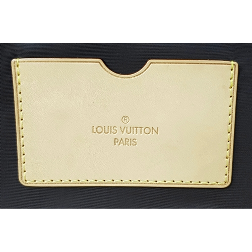 790 - A Louis Vuitton Monogram Canvas Rolling Travel Bag. Large exterior pocket and zipped compartment. Sp... 