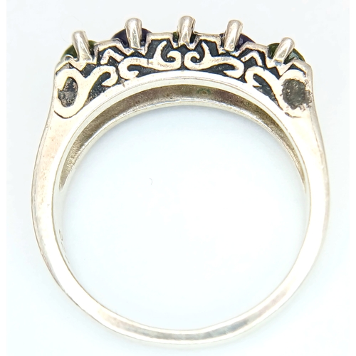 1196 - A Vintage Sterling Silver Amethyst and Peridot Ring Size S. The Ring is set with 5mm Long Oval Cut A... 