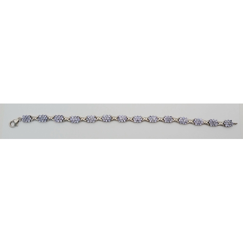 705 - An Eye-Catching Sterling Silver and Tanzanite Set Tennis Bracelet-20cm Length, 7mm Width. Set with c... 