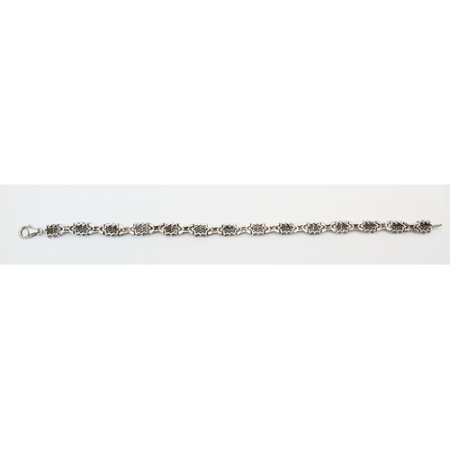 705 - An Eye-Catching Sterling Silver and Tanzanite Set Tennis Bracelet-20cm Length, 7mm Width. Set with c... 