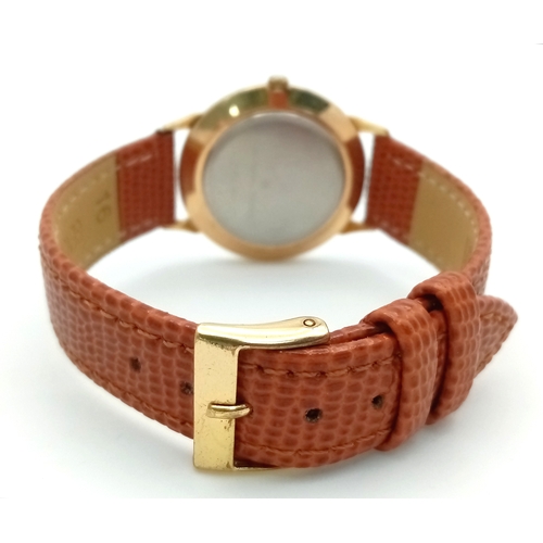 1908 - A Universal Geneve Quartz Gents Watch. Brown leather strap. Gilded case - 32mm. Gilded dial with whi... 