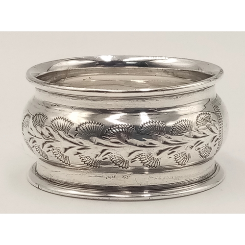 1705 - An antique sterling silver napkin holder with floral motive engravings. Full Birmingham hallmarks, 1... 
